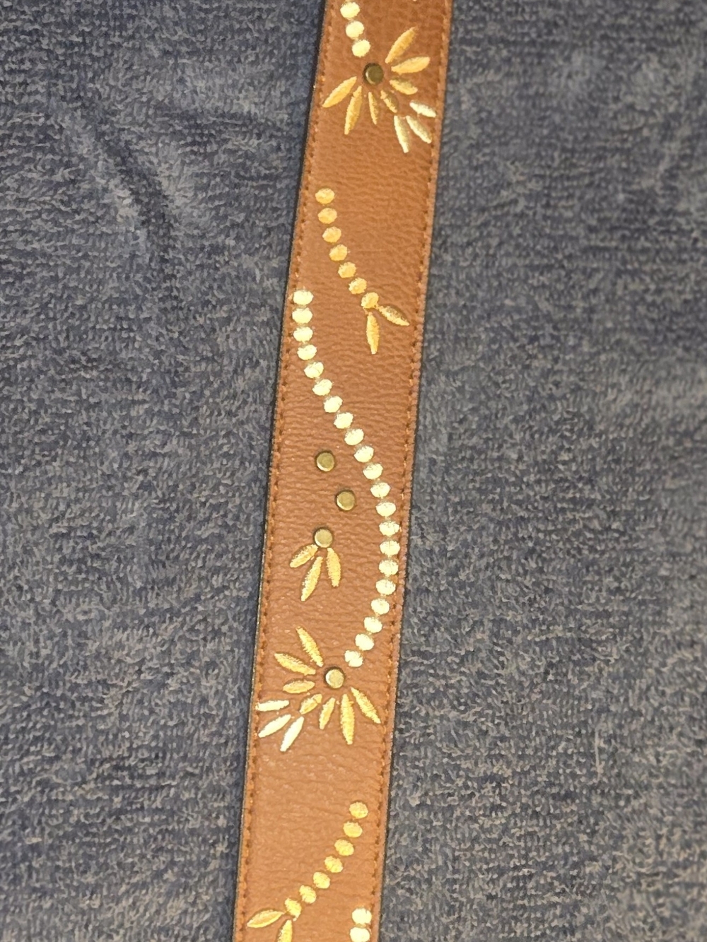 Time and Tru faux leather belt features intricate floral embroidery